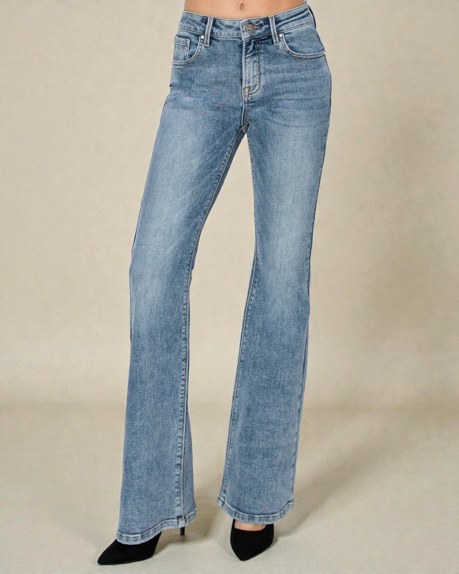 Light blue jeans on a beige background