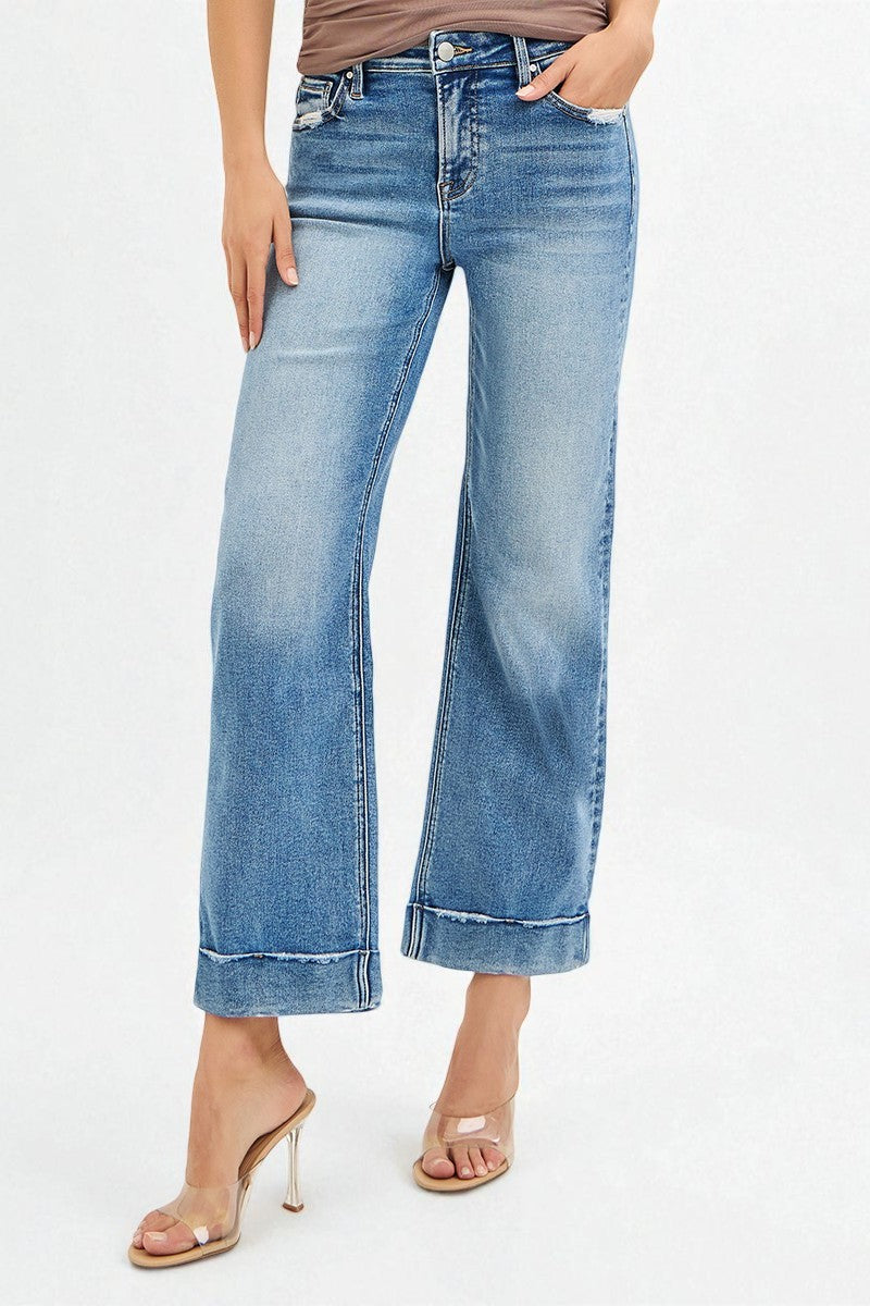 Light blue jeans worn by a person on a white background