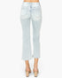 Light wash blue cropped flare jeans shown from the back on a model, paired with beige block-heel mules against a plain white background.