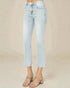Light blue jeans worn by a person on a beige background