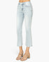 Light-wash cropped denim jeans shown on a model from the waist down, paired with beige strappy heeled sandals against a plain white studio background.