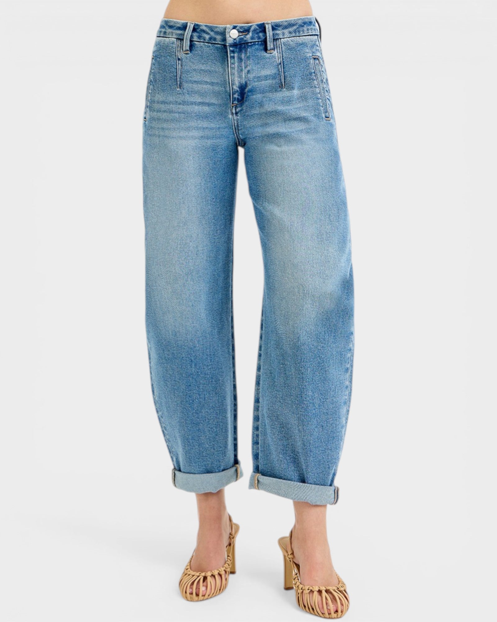 Blue jeans worn by a person on a white background