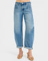 Blue jeans worn by a person on a white background