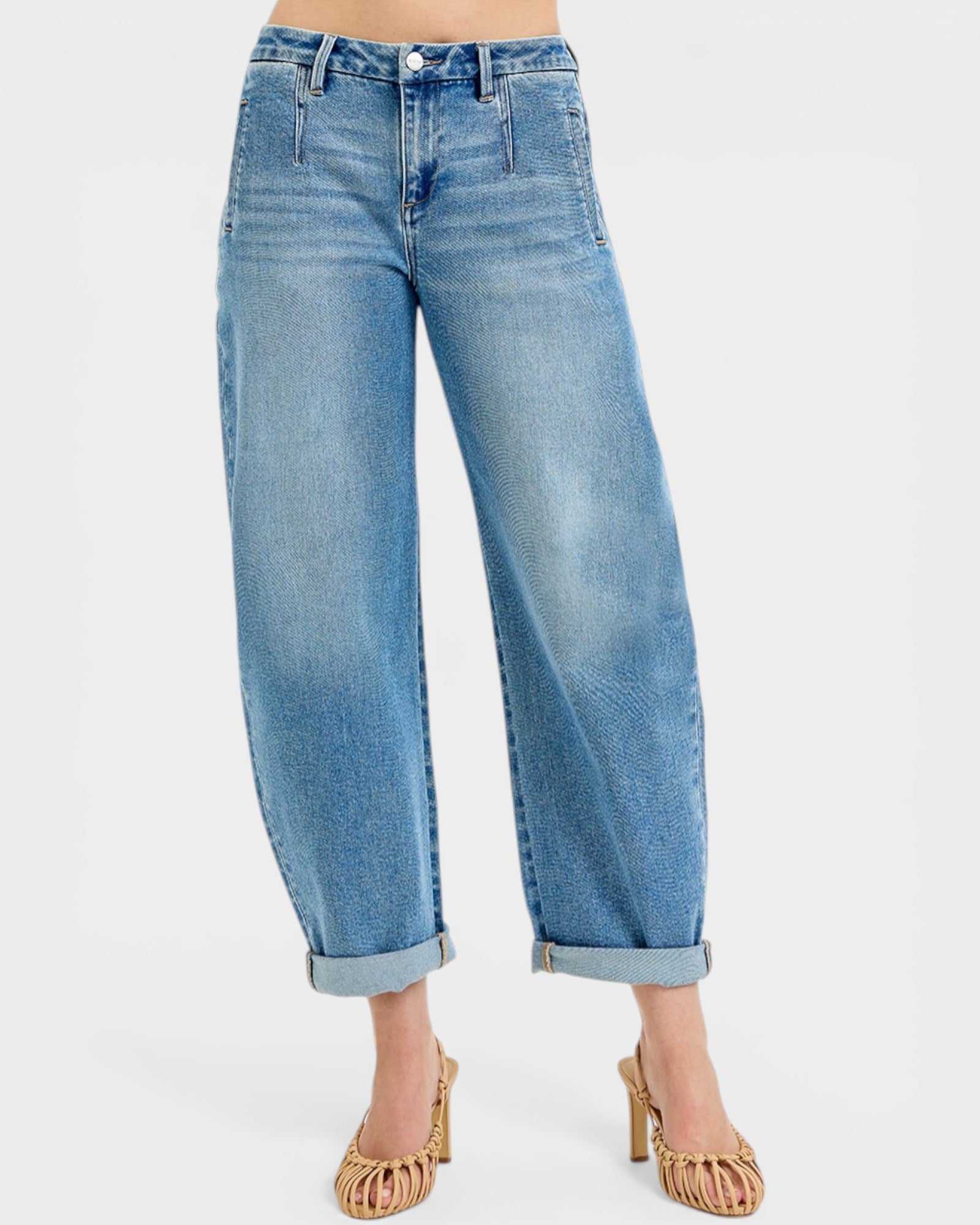 Blue jeans worn by a person on a white background
