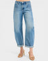 Blue jeans worn by a person on a white background