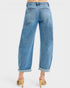 Blue jeans worn by a person on a white background