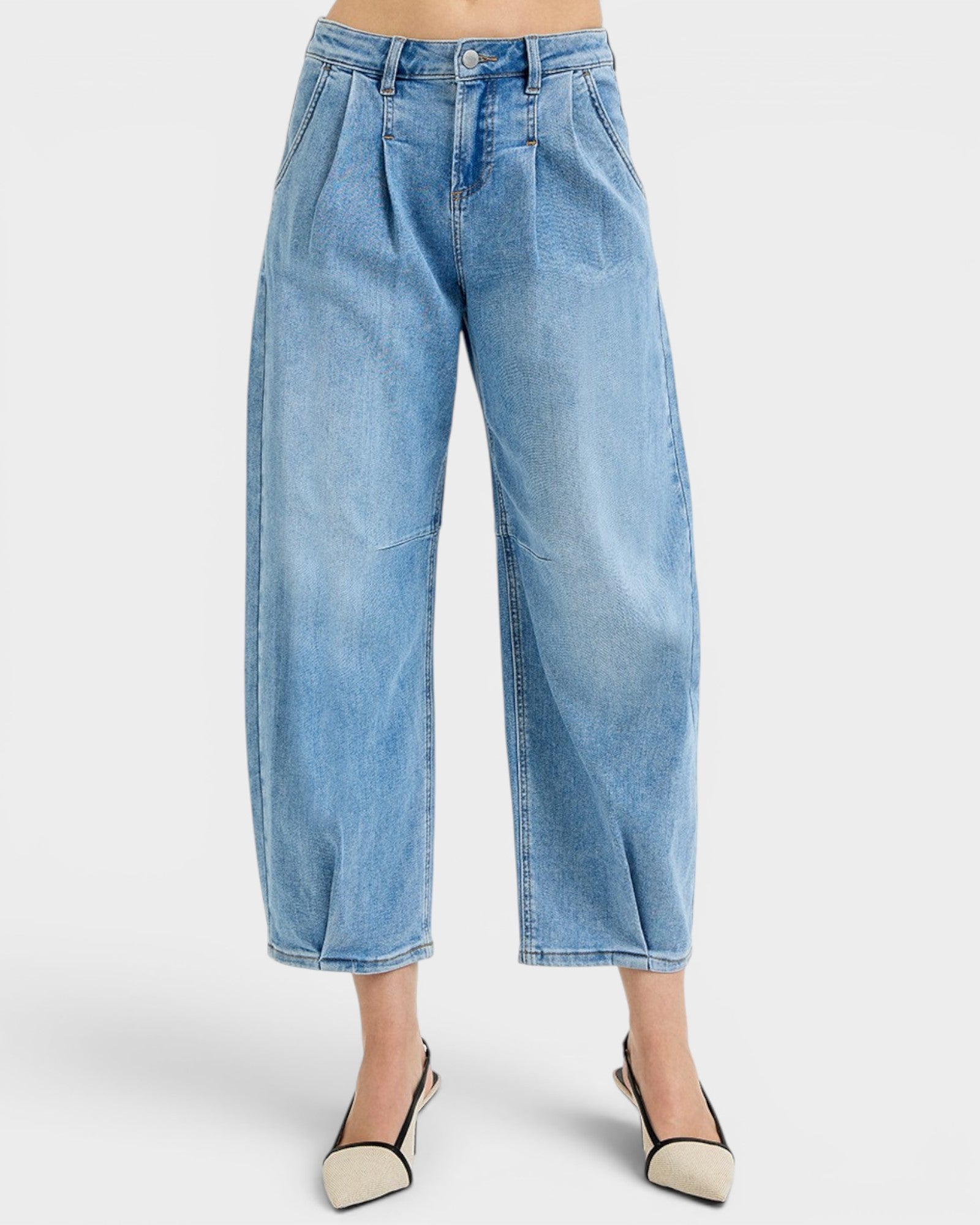 Light blue jeans worn by a person on a white background
