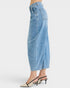 Light blue denim skirt worn by a person on a white background