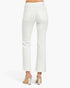 White cropped flare jeans shown from the back on a model, paired with clear high-heeled mules, against a clean white studio background.
