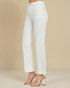 White jeans worn by a person on a beige background