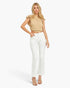 A woman modeling a beige ruffled-shoulder crop top and white cropped jeans against a light gray studio background.