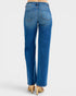 Blue jeans worn by a person on a white background