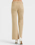 Beige pants worn by a person on a white background