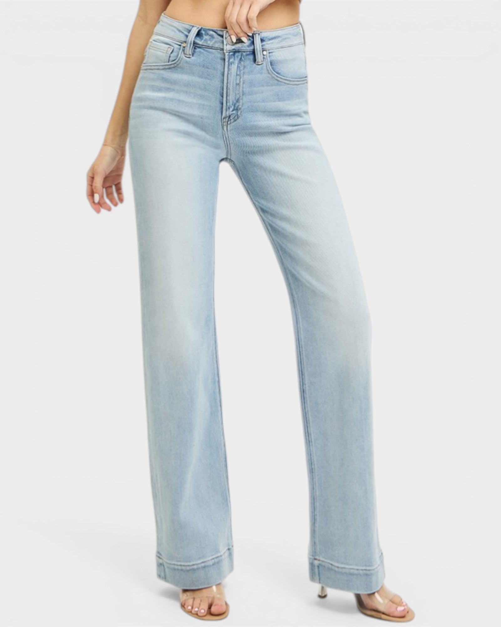 Light blue jeans worn by a person on a white background