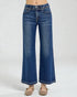 Blue jeans worn by a person on a white background
