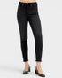 Black jeans worn by a person on a white background