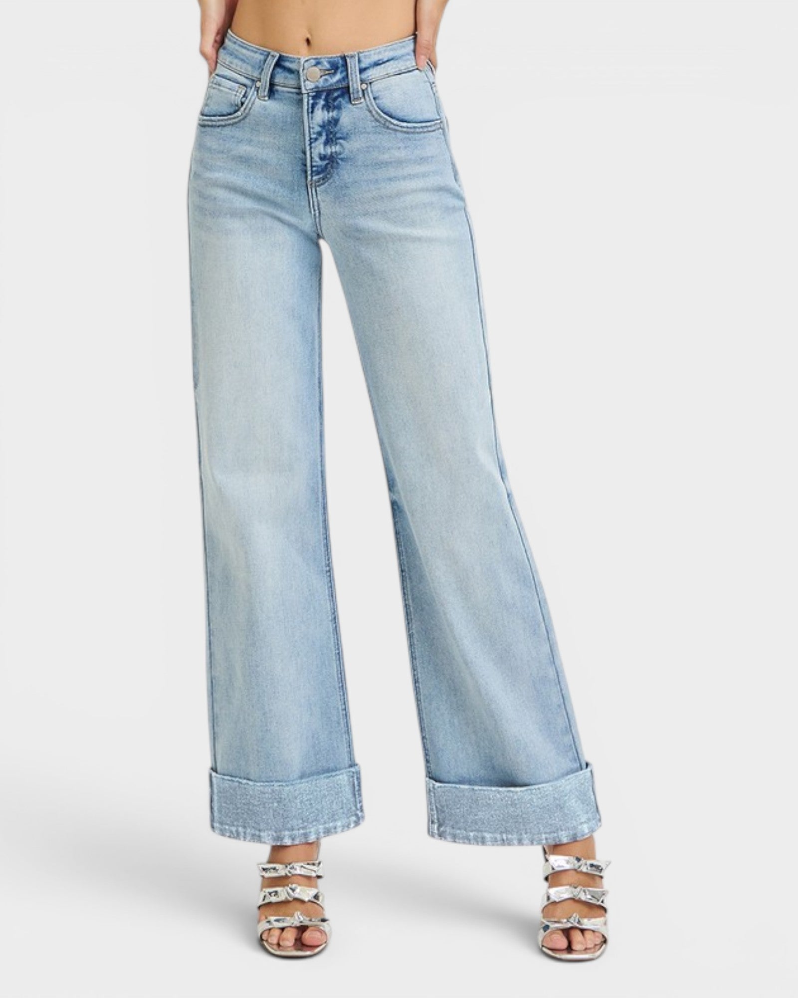 Light blue jeans worn by a person on a white background