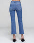 Blue jeans worn by a person on a white background