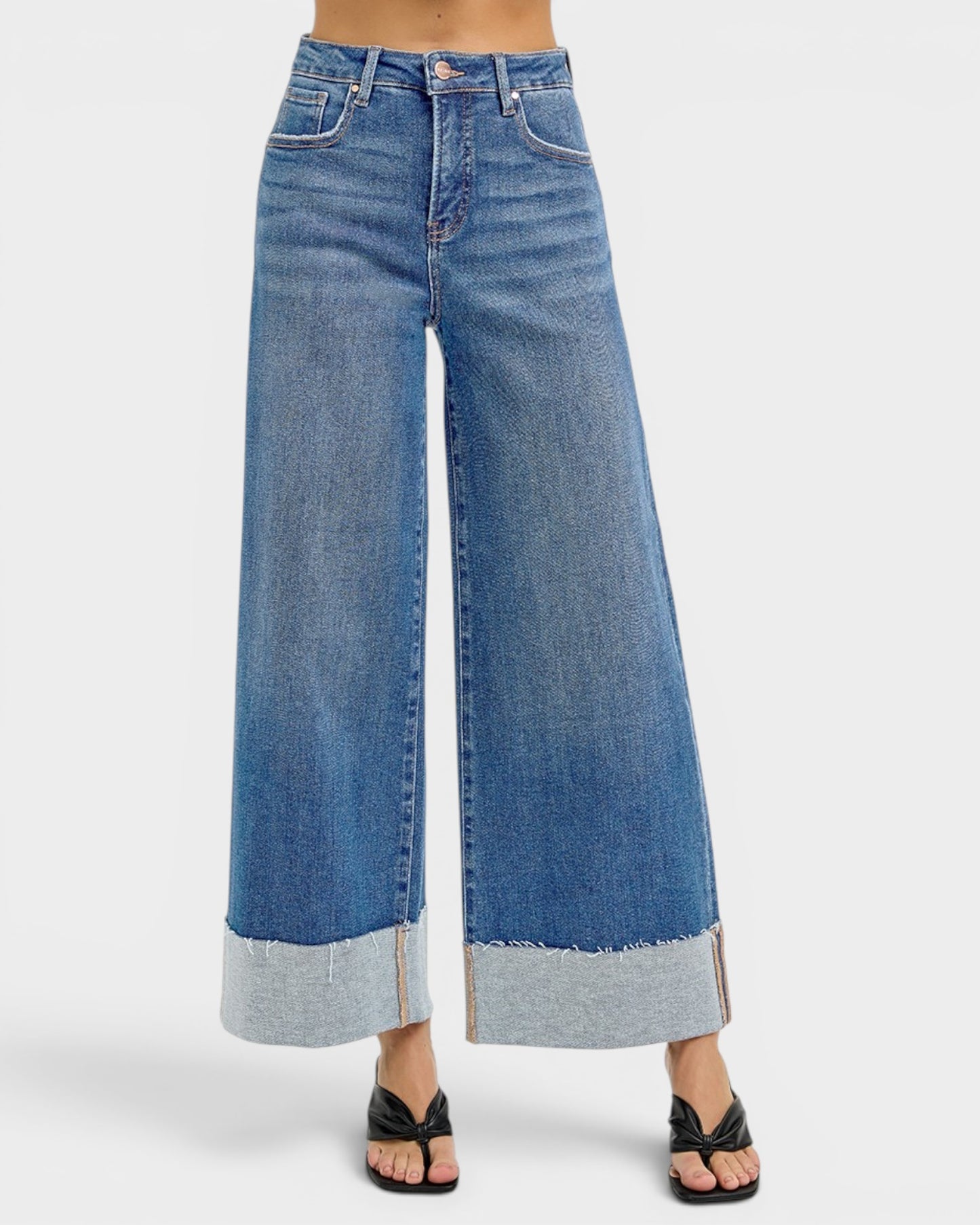 Wide-leg blue jeans on a white background