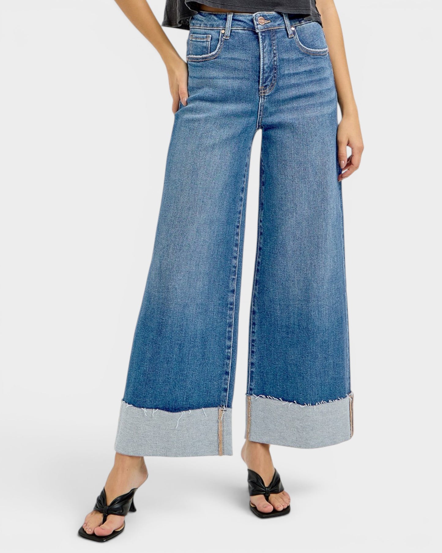 Wide-leg jeans with a light blue color scheme on a white background