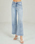Light blue jeans worn by a person on a plain background