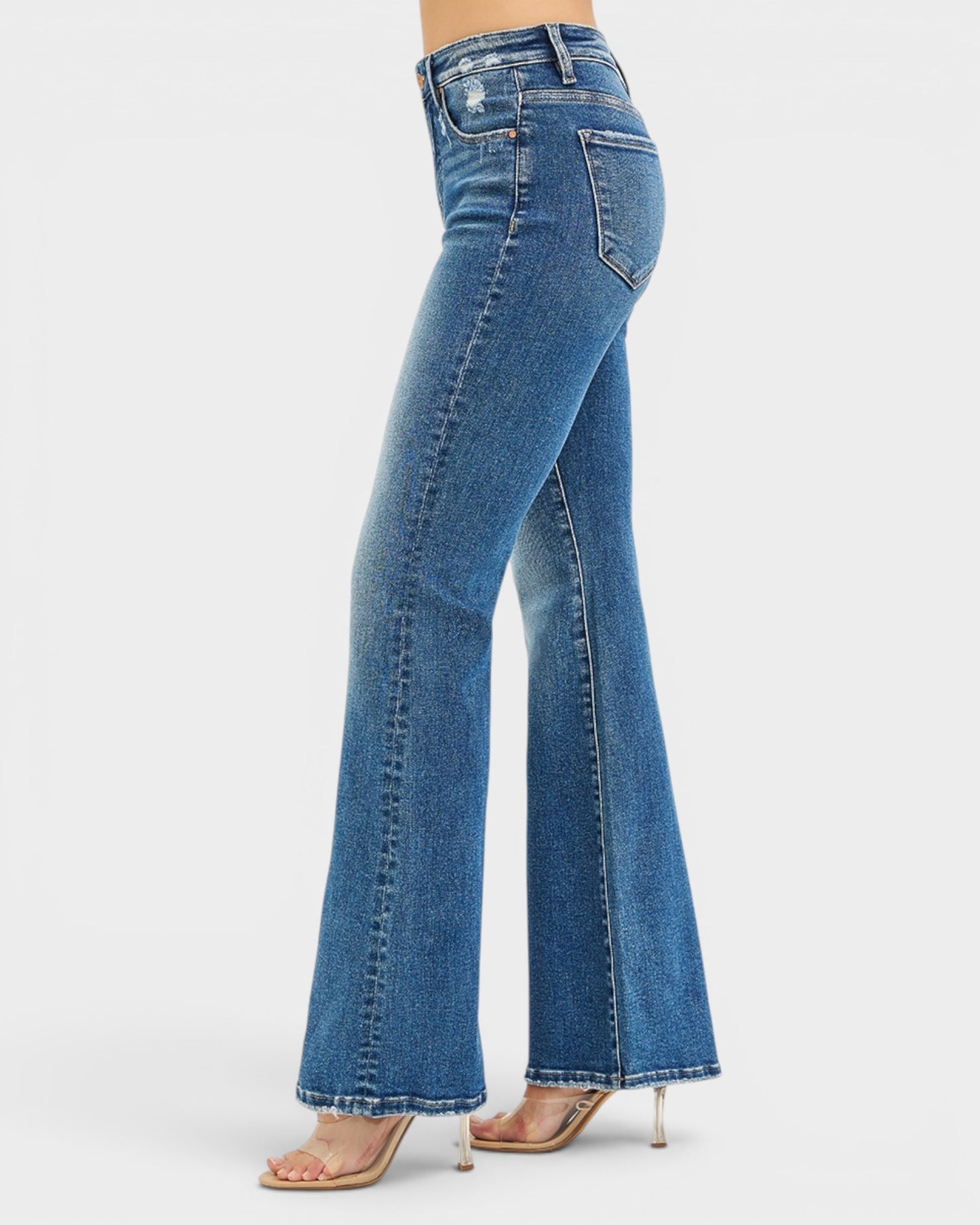 Blue flared jeans on a white background