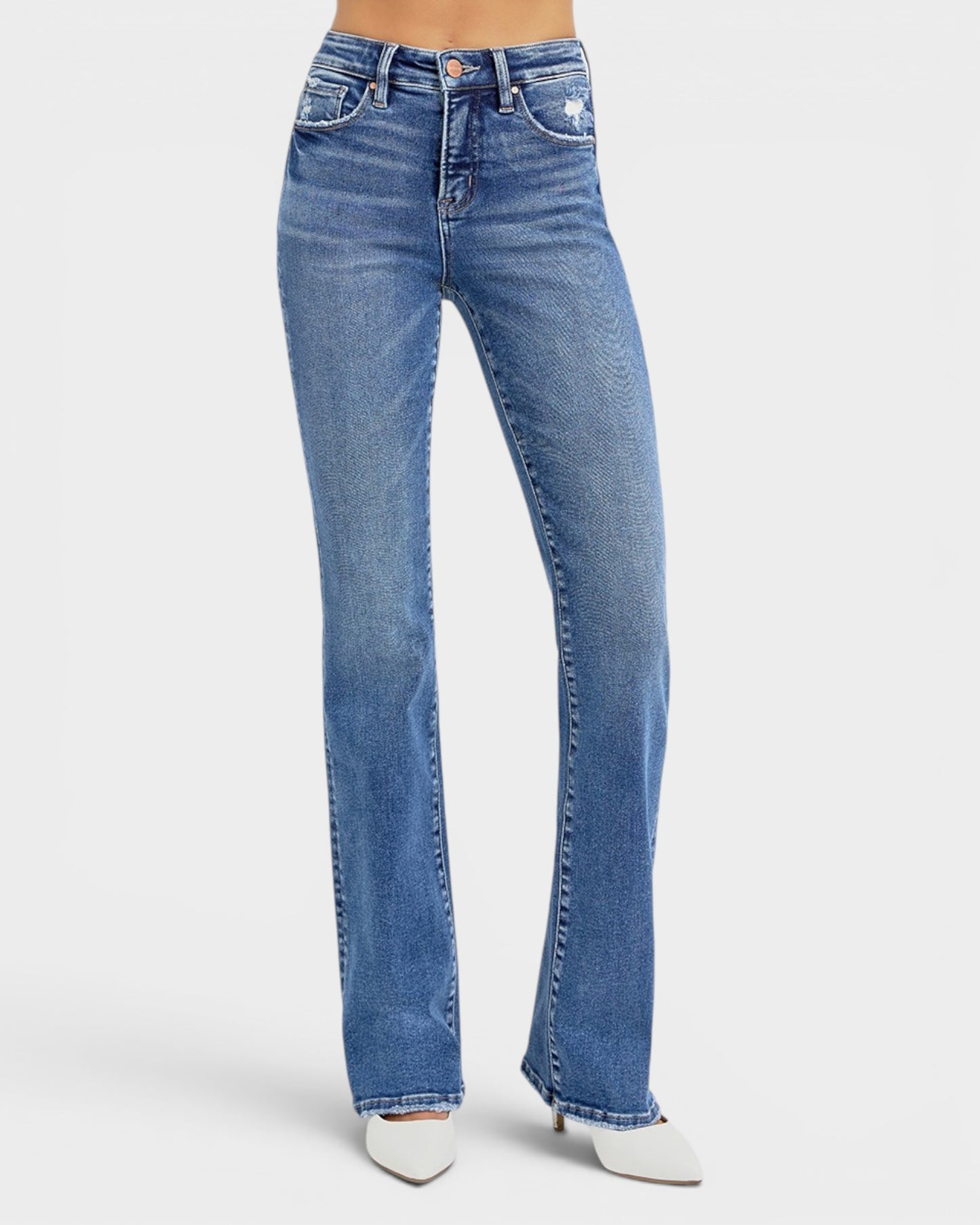 Blue jeans worn by a person on a white background