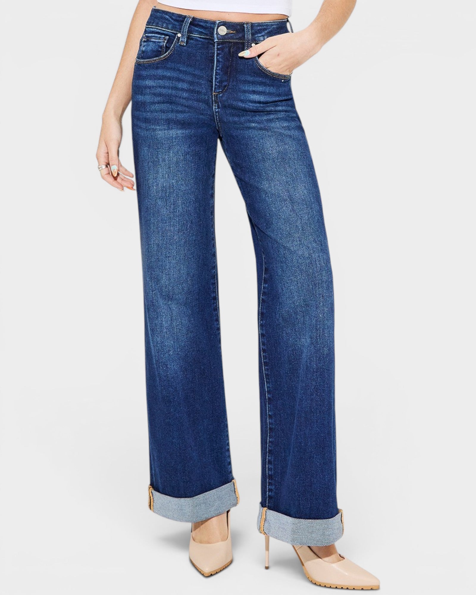 Blue jeans worn by a person on a white background