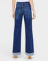 Blue jeans with rolled-up cuffs on a white background