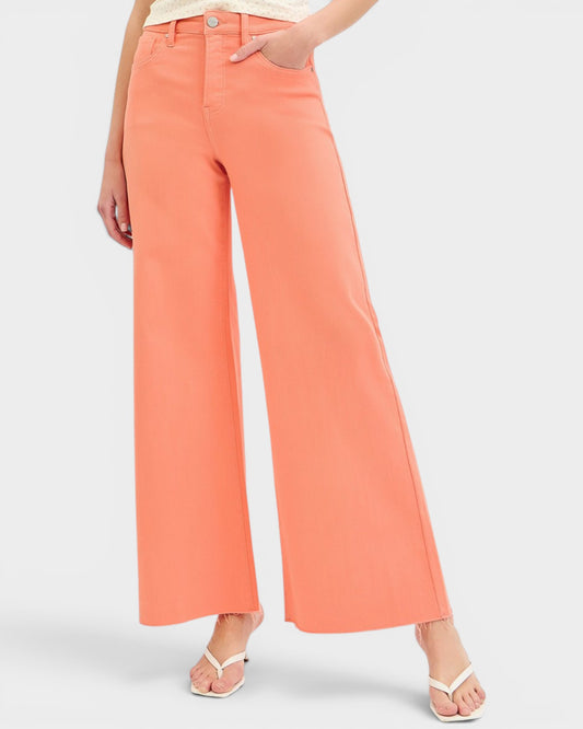 Coral wide-leg pants worn by a person on a light gray background