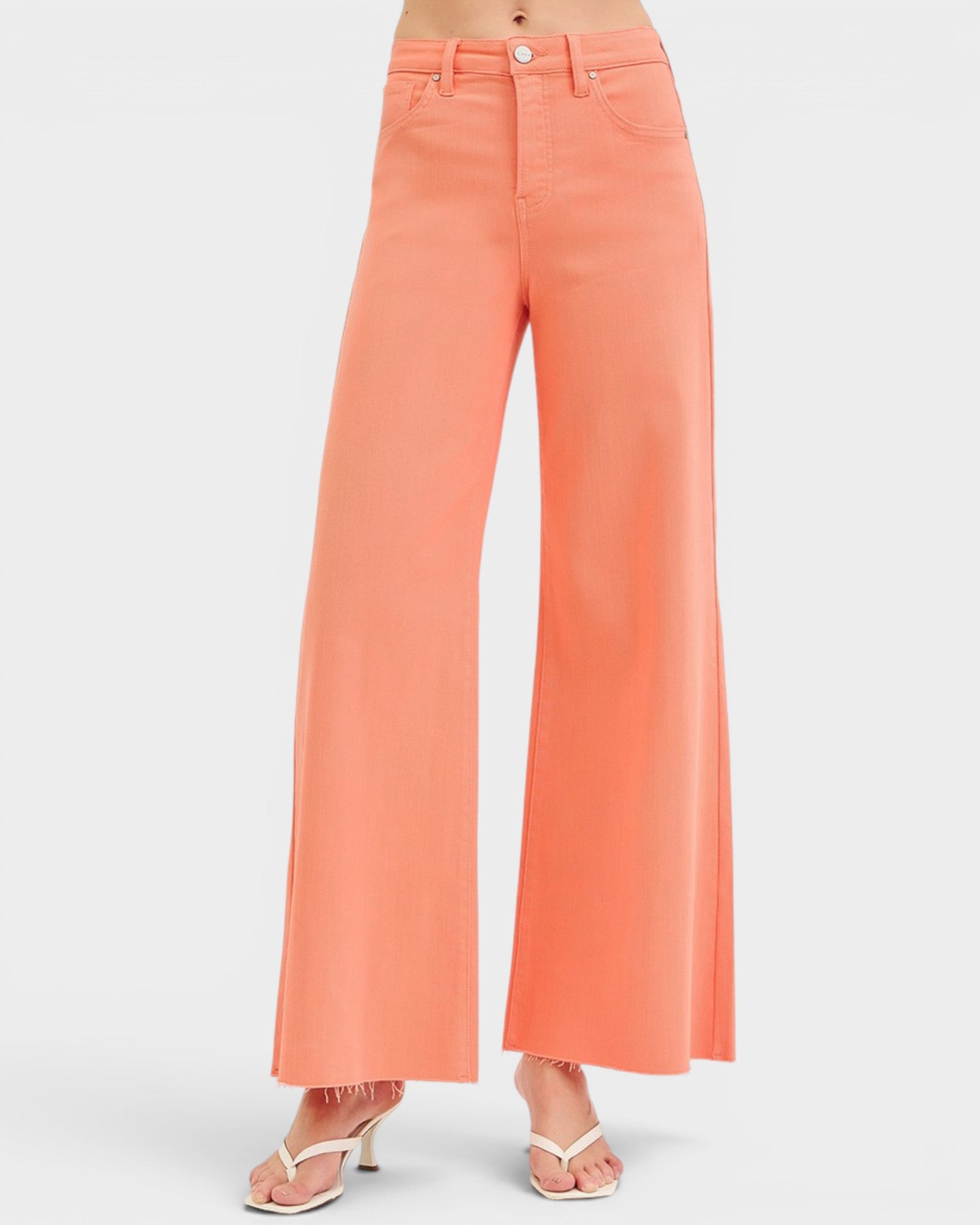 Coral wide-leg jeans on a white background