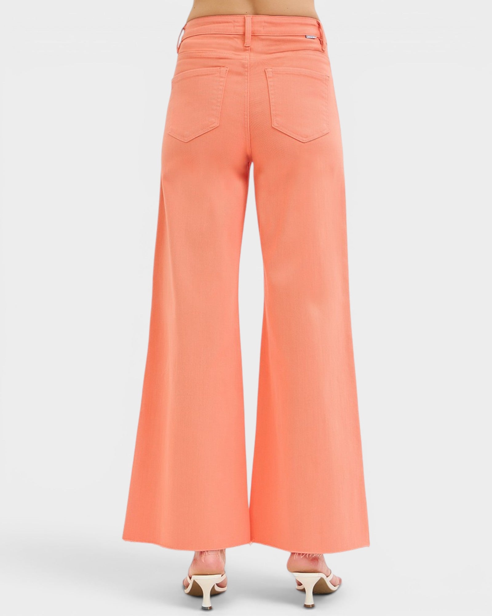 Coral wide-leg pants on a white background