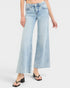 Light blue jeans worn by a person on a white background