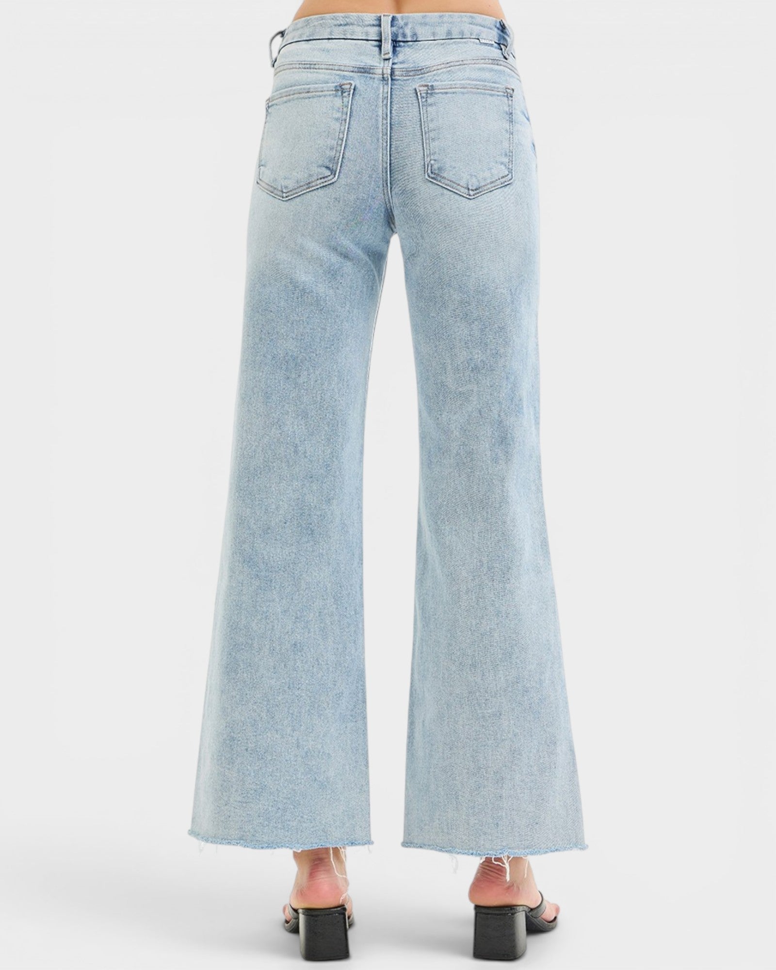 Light blue wide-leg jeans on a white background