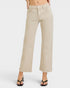 Beige wide-leg jeans worn by a person on a white background