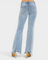 Light blue flared jeans with frayed hems on a white background
