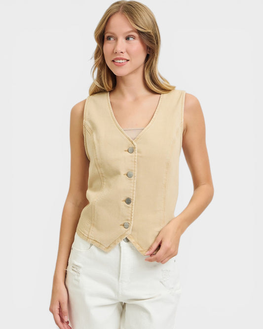 Woman wearing a beige vest on a white background