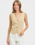 Woman wearing a beige vest on a white background