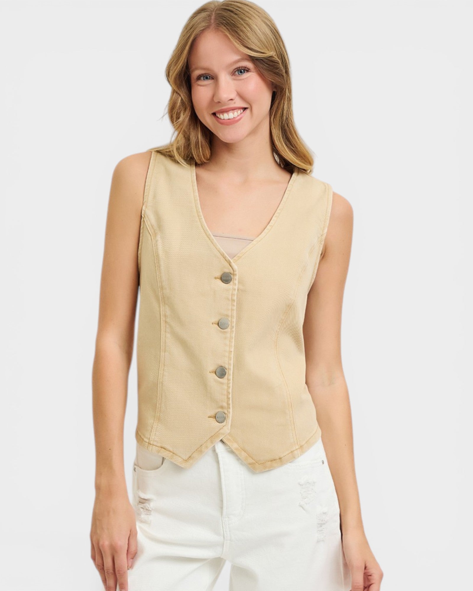 Woman wearing a beige vest on a white background