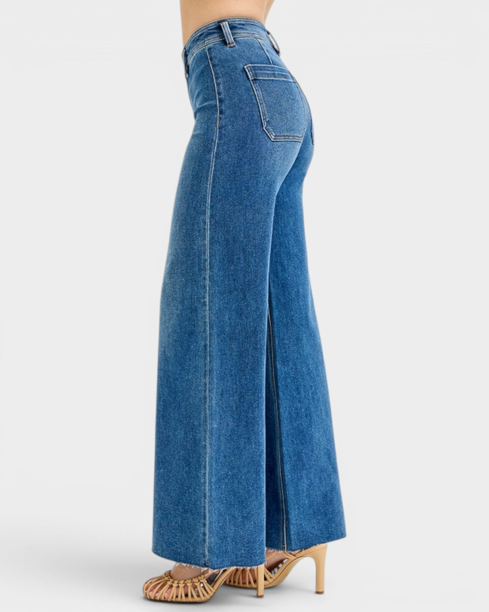 Blue jeans with a high slit on a white background