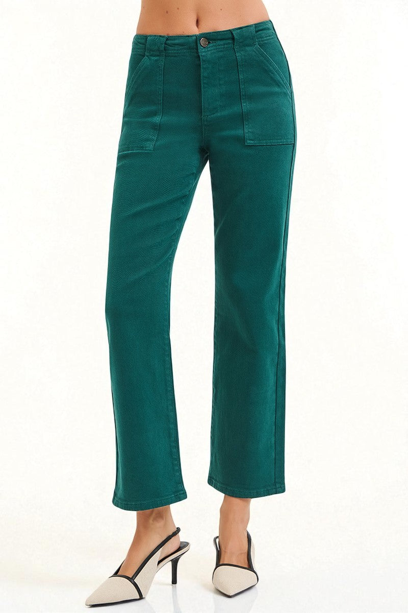 Teal pants worn by a person on a white background