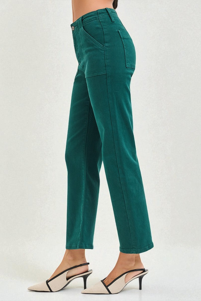 Green pants worn by a person on a white background