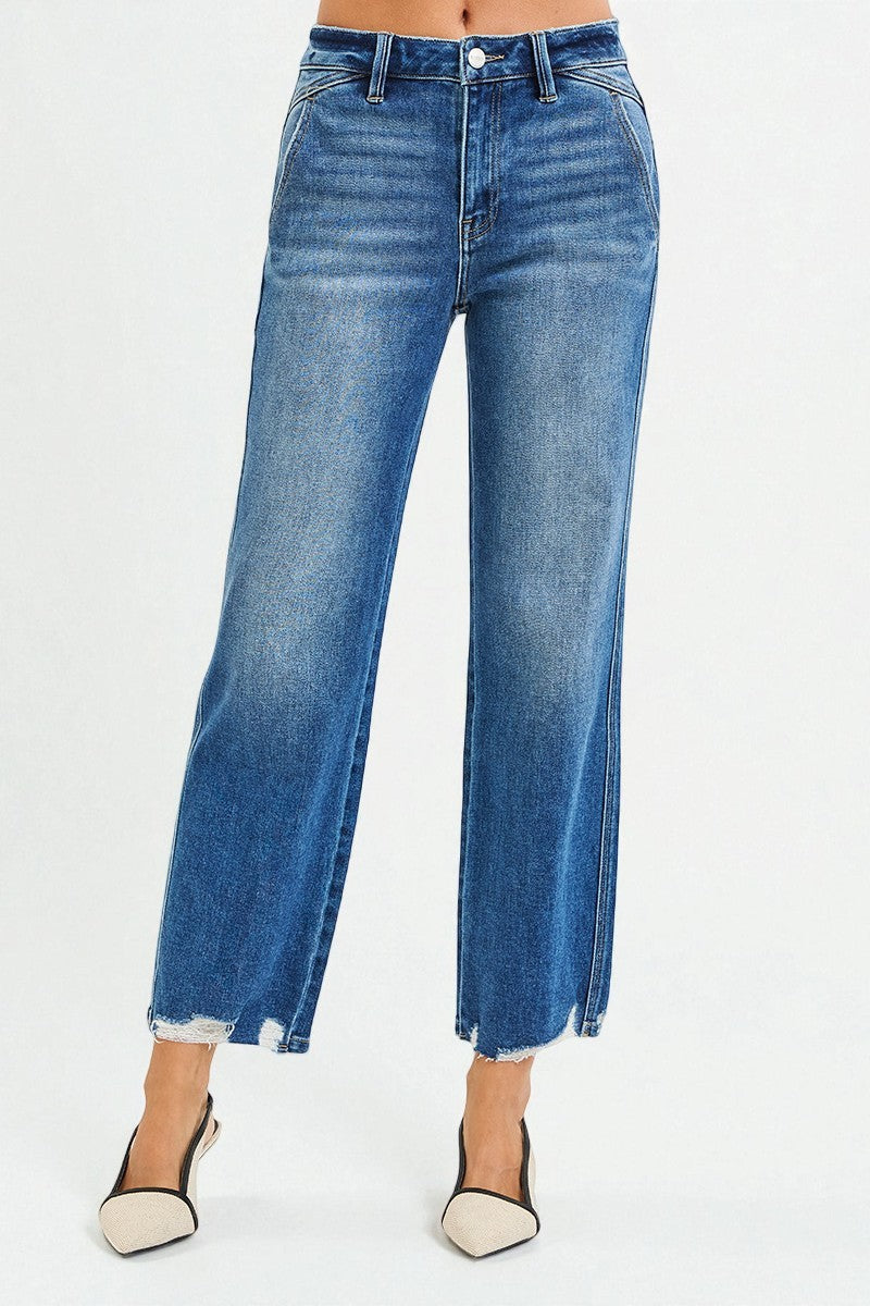 Blue jeans worn by a person on a white background