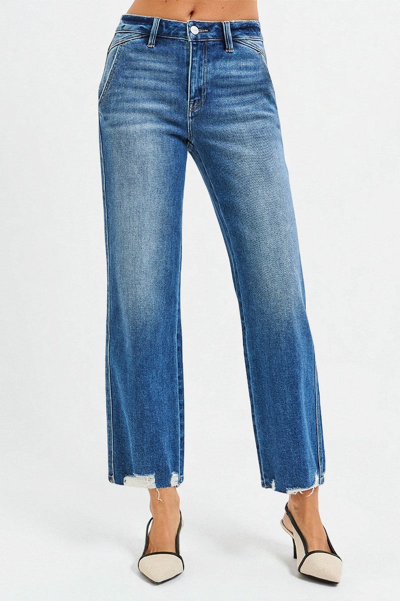 Blue jeans worn by a person on a white background