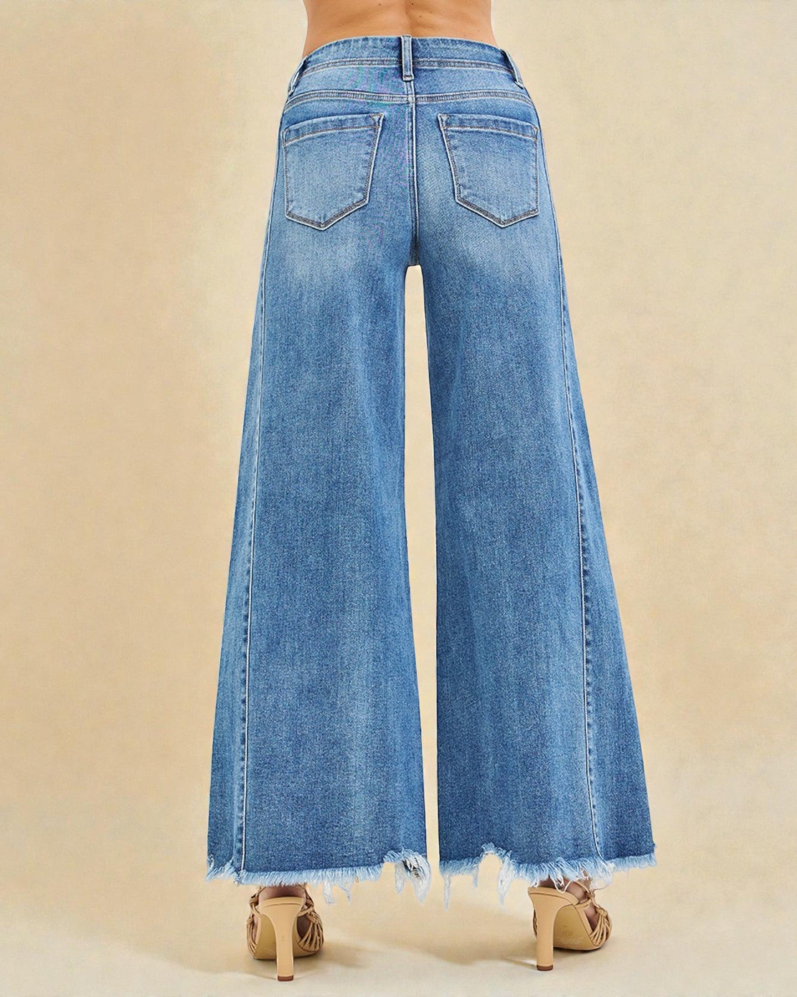 Blue jeans with a beige background