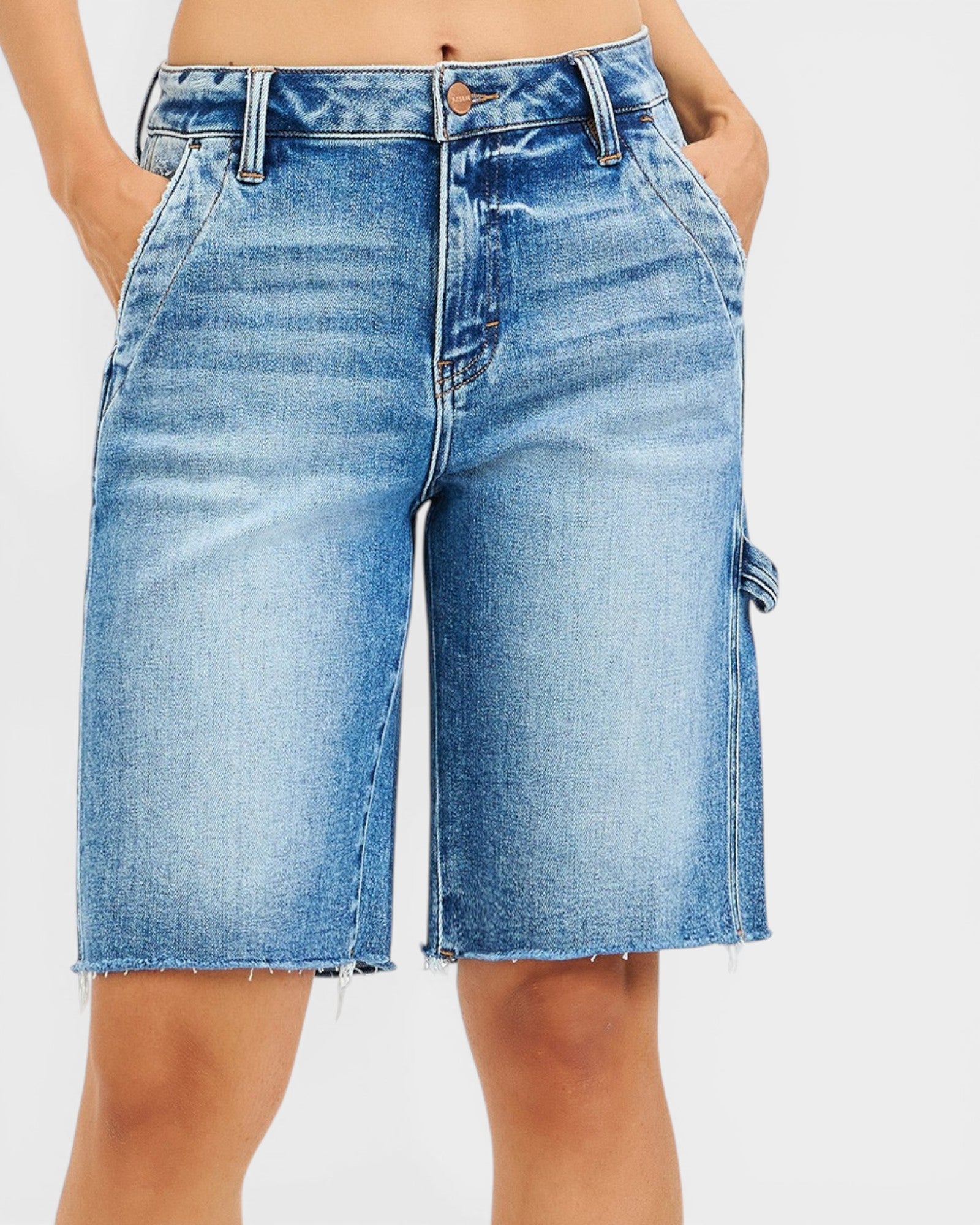 Blue denim skirt worn by a person on a white background