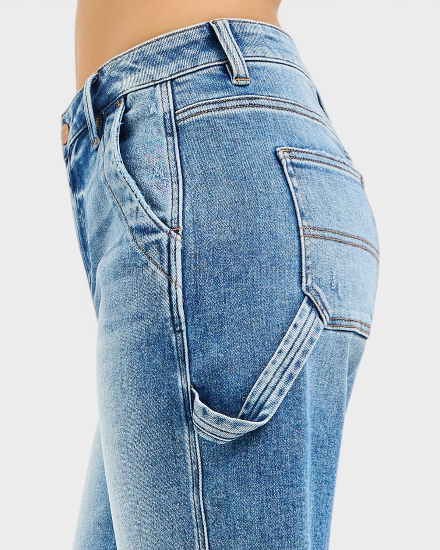 Close-up of blue jeans on a plain background
