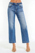 Blue jeans worn by a person on a white background