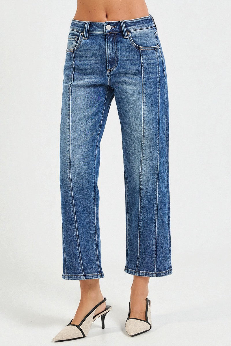 Blue jeans worn by a person on a white background