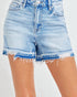 Light blue denim shorts with frayed edges on a white background